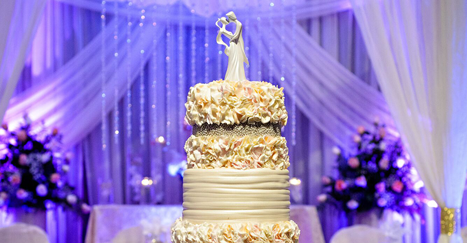 Wedding Cake With Modern Cake Topper And Floral Accents